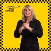 a woman stands in front of a yellow checkered background that says to row taxi