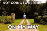 a man is running down a dirt road with the words not going to be late on my way .