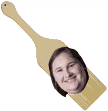 a wooden paddle with a woman 's face cut out