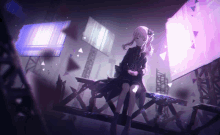 a girl in a black dress is sitting on a metal structure in a dark room