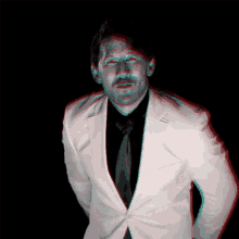 a man in a white suit has red eyes and a black shirt