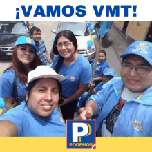 a group of people standing in front of a sign that says vamos vmt on it