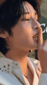 a close up of a person 's face with the letter c visible