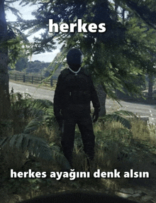 a man in a helmet is standing in a field with the words herkes behind him