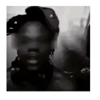 a black and white photo of a man wearing headphones and a hat with his eyes covered .