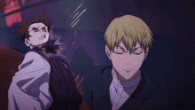 a man with blonde hair is being punched by another man
