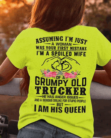 a woman wears a yellow shirt that says assuming i 'm just a woman was your first mistake