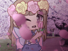 a girl with a flower crown on her head holding a flower