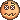 a pixel art of a pumpkin with a face on it