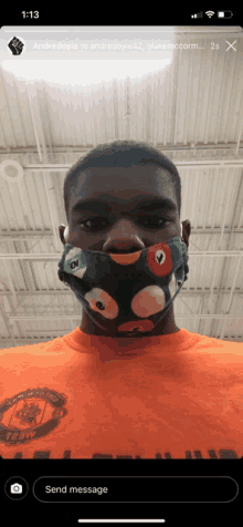 a man wearing an orange shirt and a green face mask is being sent a message