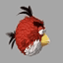 a red angry bird with a yellow beak and black feathers is flying in the air .