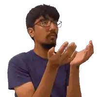 a man wearing glasses and a blue shirt is clapping