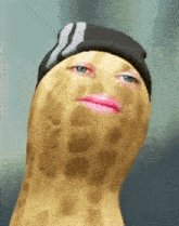 a peanut with a pink lip and a hat on .