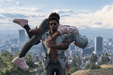 a man is carrying a woman in his arms in front of a city skyline