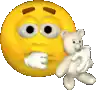 a smiley face is holding a teddy bear and a piece of paper .