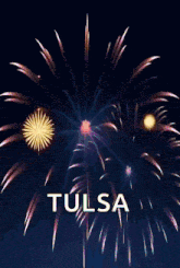 a fireworks display with the words happy new year tulsa written below it