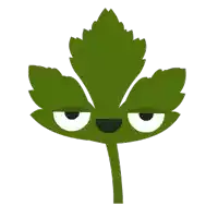 a green leaf with white eyes and a face