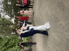 a bride and groom are dancing in front of a crowd of people