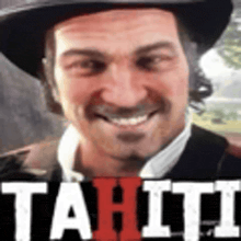a man wearing a hat and a suit is smiling with the word tahiti in the background .