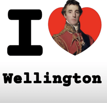 a sign that says i love wellington with a picture of a man on it