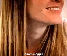 a close up of a woman 's face with adam 's apple written below