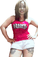 a woman wearing a red tank top that says ' muay thai ' on it