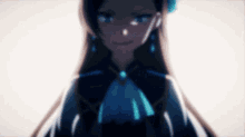 a blurry picture of a girl with long hair and blue earrings .