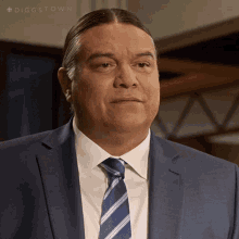 a man in a suit and tie with the hashtag #diggstown on the bottom