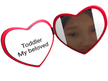 a red heart shaped mirror with the words toddler my beloved on it