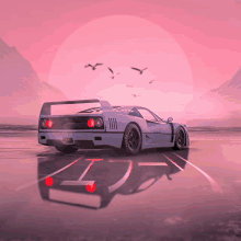 a ferrari sports car is driving down a road with a pink background