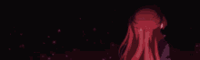 a girl with long red hair is standing in the dark with a red bow on her head .