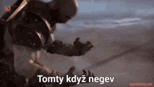 a video of a man with the words tomty kdyz negev written on the bottom