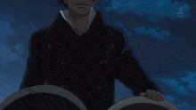 a man in a black jacket stands in front of a blue sky with a tbs logo on the bottom right