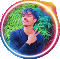 a man giving a peace sign in front of a rainbow colored circle