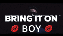 a man in sunglasses stands in front of the words bring it on boy