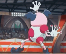 a pink and white cartoon character with a crown on its head is walking in a stadium .