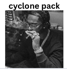 a black and white photo of a man smoking a cigar with the words cyclone pack underneath him