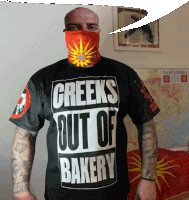 a man wearing a greeks out of bakery t-shirt