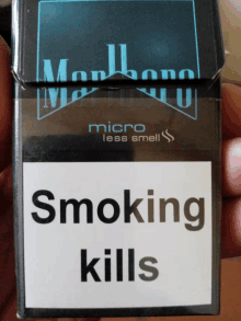 a pack of marlboro micro less smell cigarettes in a hand