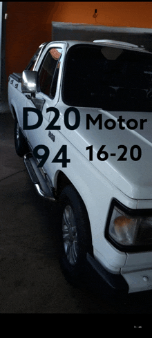 a white truck with the words d20 motor 94 16-20 on the side