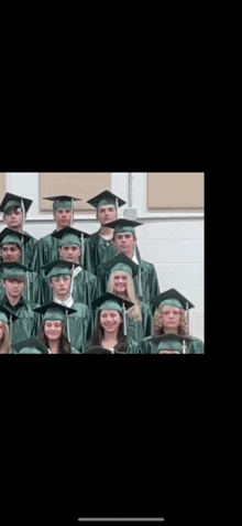 a group of graduates posing for a picture