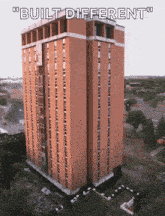 an aerial view of a tall building with the words " built different " below it