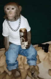 a monkey wearing a white shirt and blue jeans is holding a can of hazelnut coffee