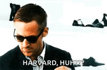 a man in a suit and tie is wearing sunglasses and saying harvard , huh ?