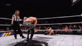 a wrestler in a ring with the word live on the bottom right