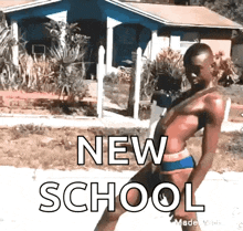 a man in a bikini is standing in front of a house with the words new school written on the ground