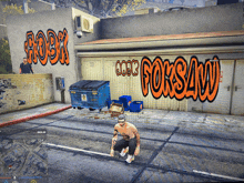 a man squatting in front of a building with graffiti on it that says forsaw