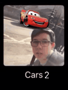 a picture of a boy with a lightning mcqueen car behind him and the words cars 2