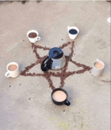 a pentagram made out of coffee beans with a coffee pot in the center