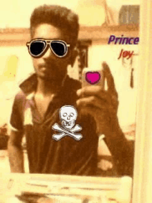 a man wearing sunglasses is taking a selfie in front of a mirror with the name prince joy written on the bottom